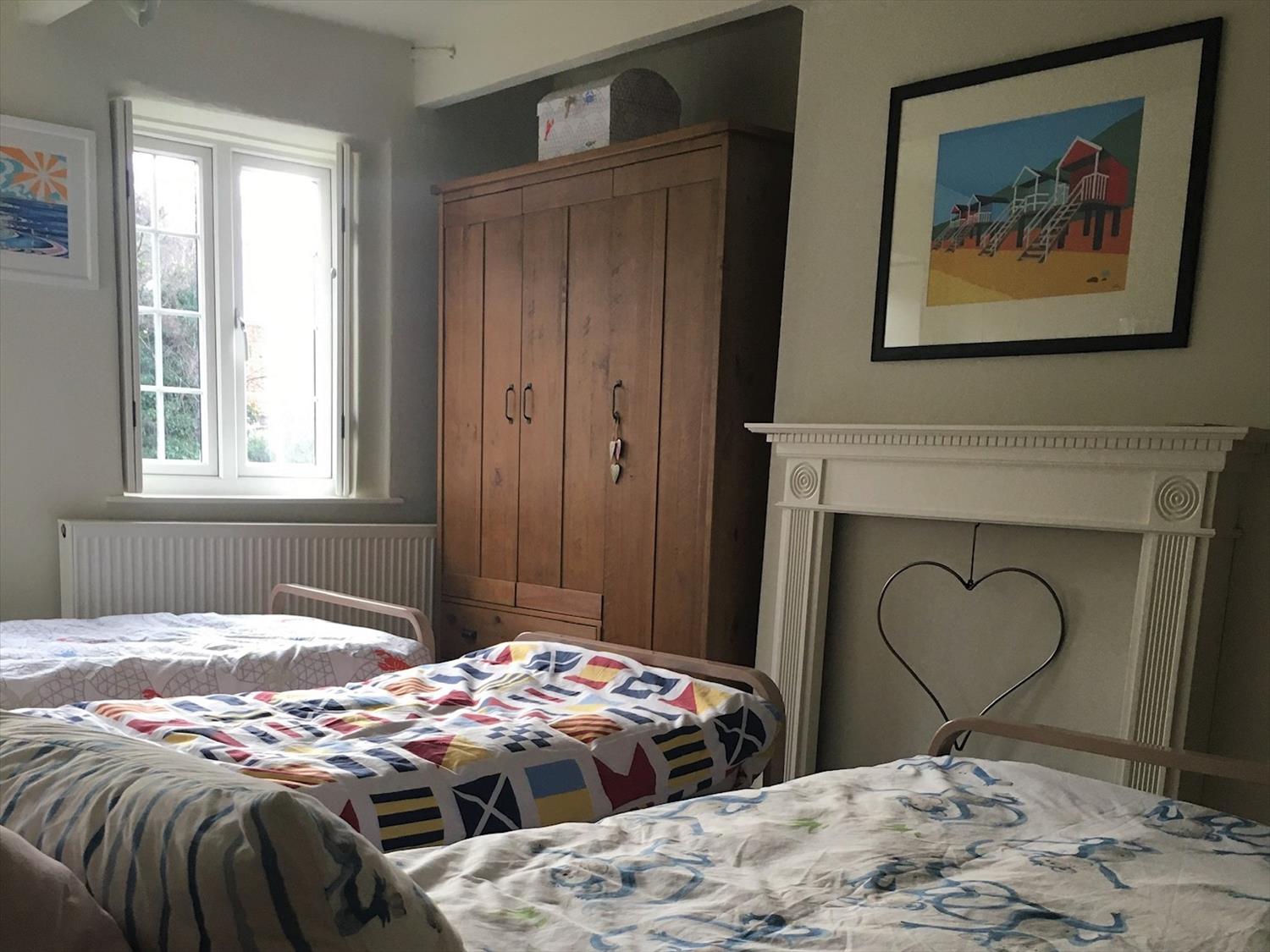Triple single bedroom with dressing table, large wardrobe, chest of drawers@NorfolkCoastline
