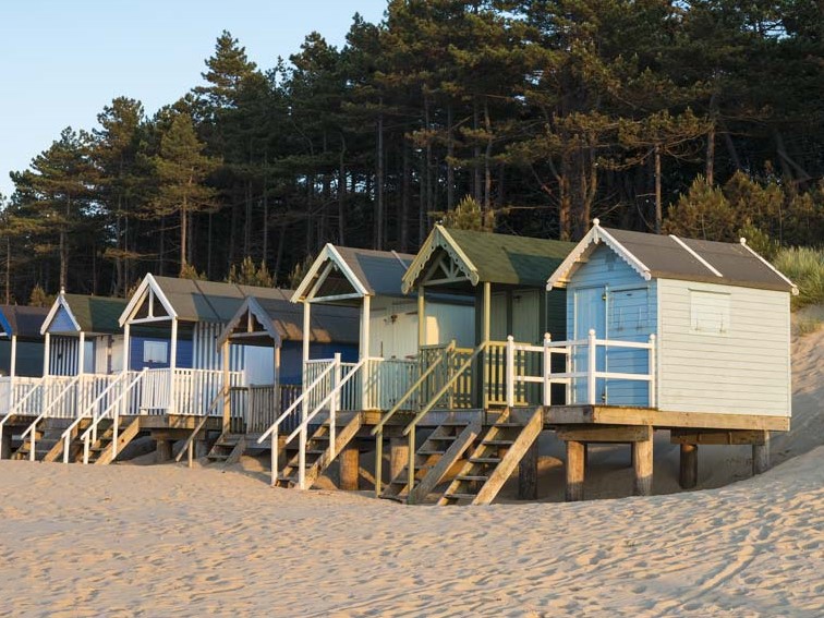 Beautiful beach huts on stilts on Wells-Next-The-Sea beach @NorfolkCoastline
