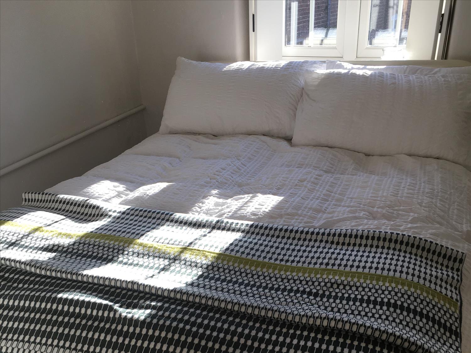 Cream wrought iron double bed @NorfolkCoastline
